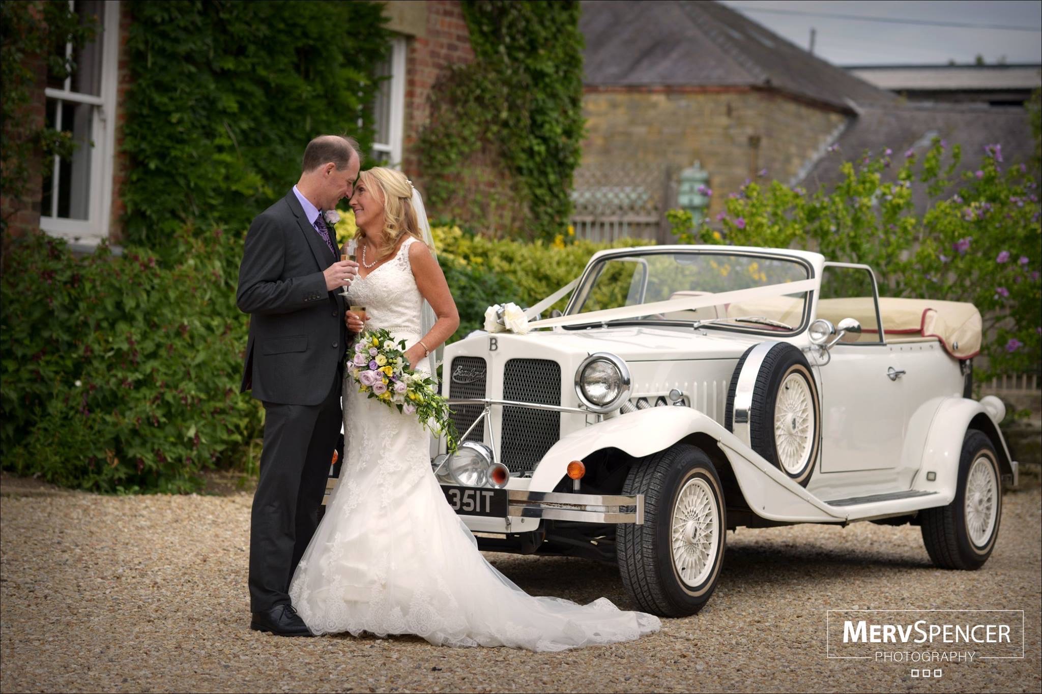 The Bride & Groom arriving from Church in Bonnie, the wedding car, at Shottle Hall, Derbyshire