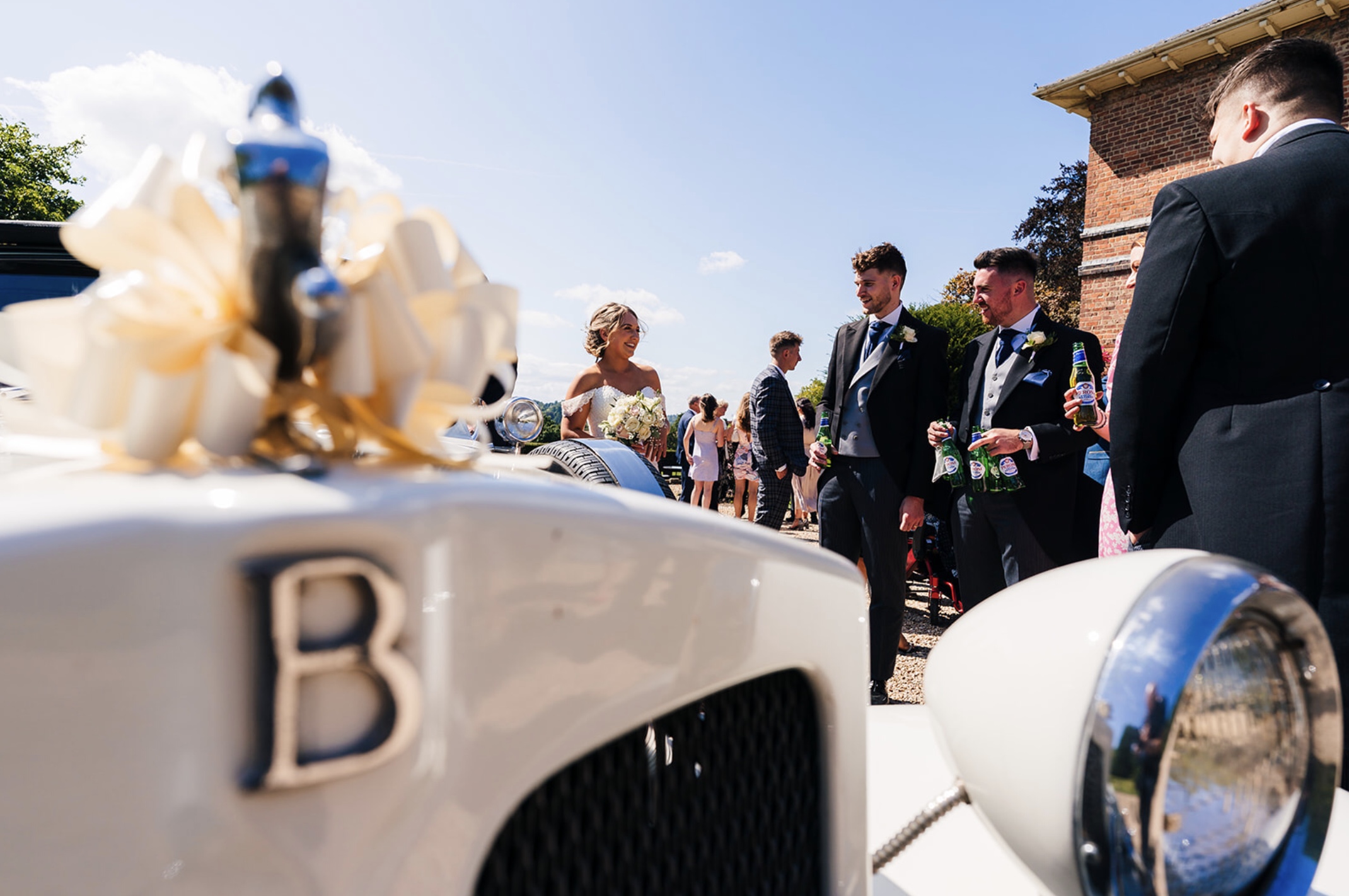 Wedding Guests milling around Bonnie at Shottle Hall, Derbyshire